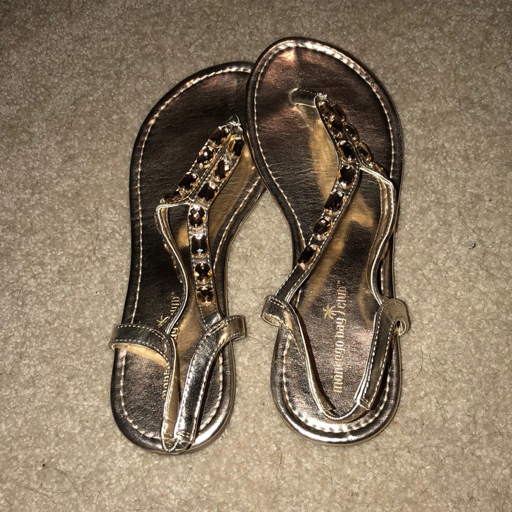 Gold sandals with gem detail